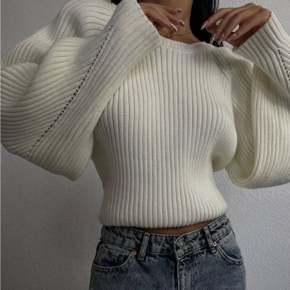 Lace up back sweater with puff sleeves. Warm and has good stretch